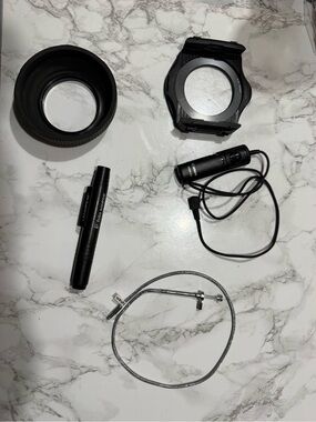 Photography odds and ends- shutter releases cords, lens pen, hood & filter mount
